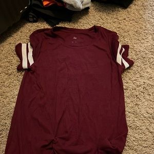 maroon varsity shirt.